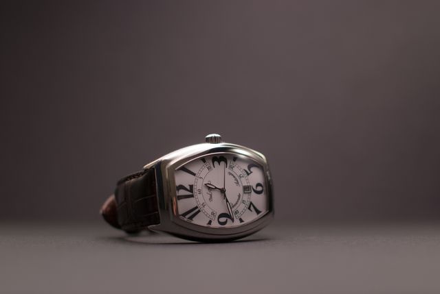 Upscale luxury watch with a leather strap, presented on a dark background, exuding sophistication and elegance. Suitable for advertisements, fashion editorials, and lifestyle blogs focusing on premium accessories and timeless style.
