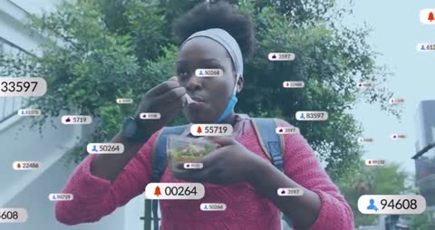 Student Commuter Eats Salad While Engaging with Social Media