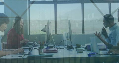 Diverse team engaged in financial data analysis in modern office