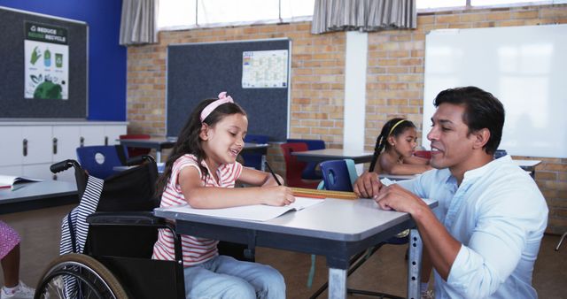 Teacher Assisting Young Wheelchair-bound Girl in Classroom Setting - Download Free Stock Images Pikwizard.com