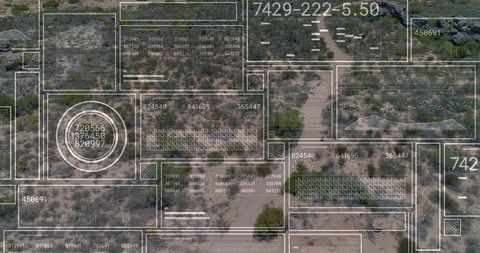 Aerial cadastral overlay over arid scrubland showing parcel boundaries, gis grids
