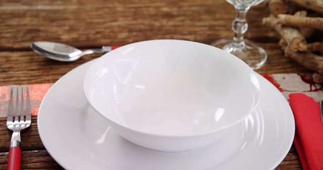 Elegant Dinner Table Setting with White Dishware on Rustic Wooden Surface - Download Free Stock Images Pikwizard.com