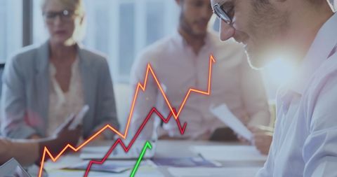 Businessman Analyzing Statistical Growth Data in Office Meeting