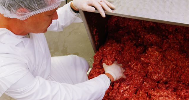 Butcher Preparing Fresh Minced Meat in White Apron - Download Free Stock Images Pikwizard.com