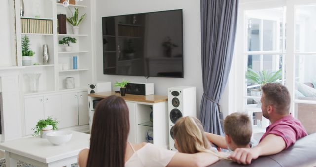 Family Watching TV in Modern Living Room - Download Free Stock Images Pikwizard.com