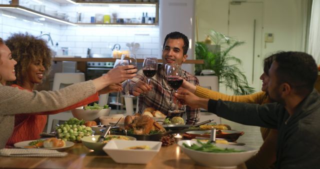 Friends Enjoying Dinner Together Toasting with Wine Glasses - Download Free Stock Images Pikwizard.com