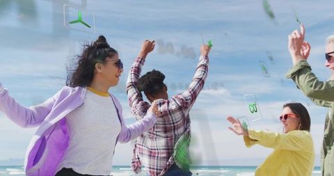 Friends celebrating on beach with augmented reality holograms, bright jackets, sunglasses