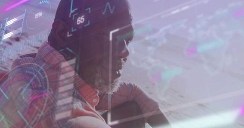 Senior man reflecting with futuristic holographic data overlay and ui graphs