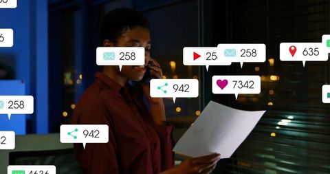 Businesswoman Multitasking in Modern Office Surrounded by Digital Notifications