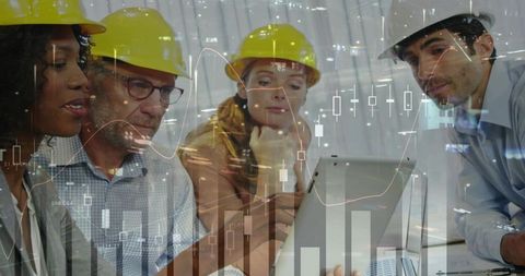 Construction team reviewing analytics dashboard on laptop, collaboration in hard hats