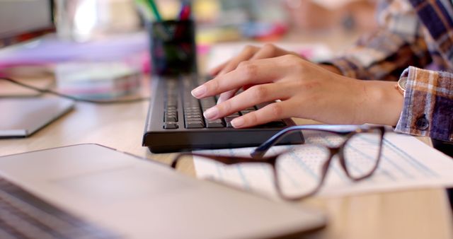 Person Typing on Keyboard Working at Wooden Desk in Office - Download Free Stock Images Pikwizard.com