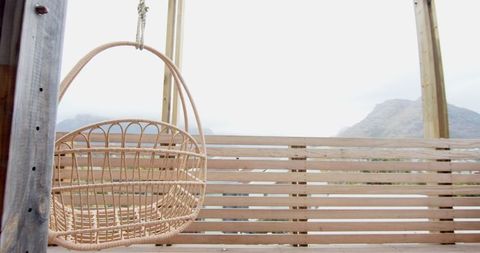 Wicker Hanging Chair Overlooking Mountain View from Deck
