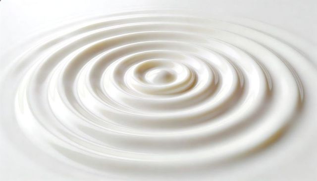 Concentric milky ripples with glossy highlights minimalist cream surface abstract background