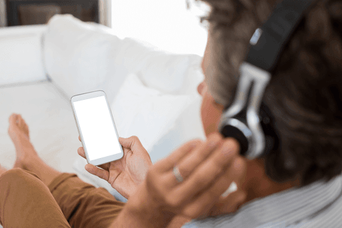 Man Delivering Leisurely Music Experience with Earphones - Download Free Stock Videos Pikwizard.com