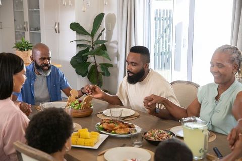 Family Sharing Gratitude Around Dinner Table