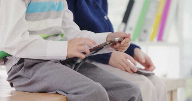 Child Using Tablet While Sitting Next to Teacher in Classroom - Download Free Stock Images Pikwizard.com