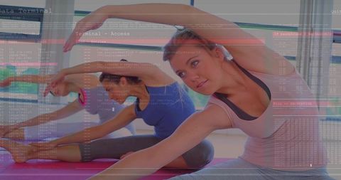 Group stretching in yoga class blending fitness practice with digital code overlay