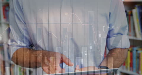 Business Professional Analyzing Financial Data on Digital Tablet