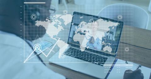 Businessman in Office Analyzing Global Data on Laptop Screen