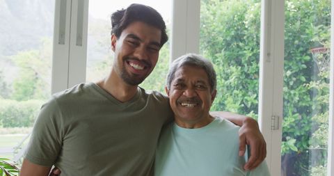 Joyful Father and Son Sharing Happy Moments at Home