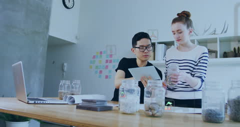 Diverse Colleagues Discussing Sustainable Concepts in Modern Office