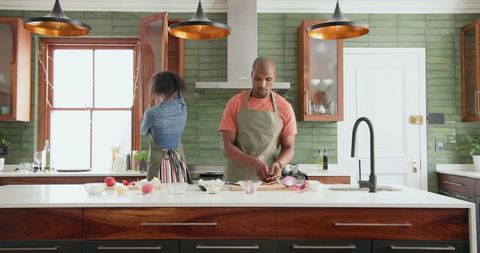 Couple Preparing Meal and Organizing in Modern Kitchen Together