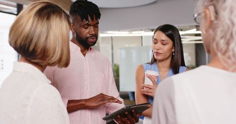 Diverse Team Collaborating in Modern Office on Digital Project
