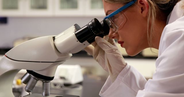 Female Scientist Examining Samples With Microscope in Laboratory - Download Free Stock Images Pikwizard.com