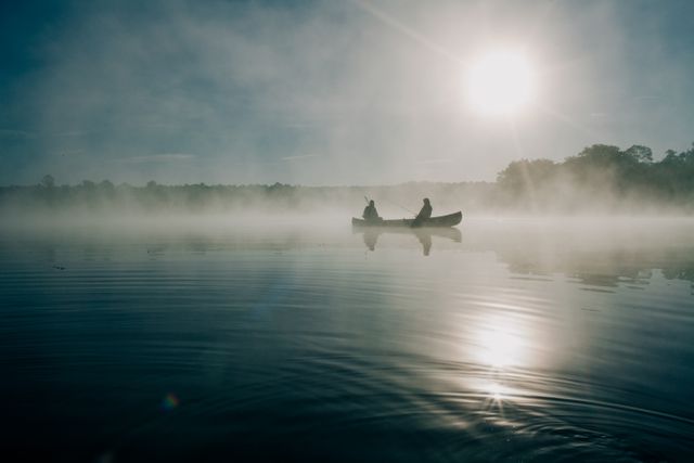 Tranquil Morning Canoeing On Misty Lake - Download Free Stock Photos Pikwizard.com