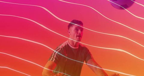 Energetic male on stationary bike with neon streaks and motion