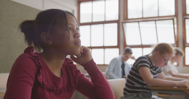 Student Deep in Thought in Classroom Setting - Download Free Stock Images Pikwizard.com