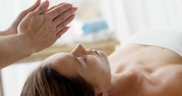 Therapist Performing Reiki on Woman at Spa - Download Free Stock Images Pikwizard.com