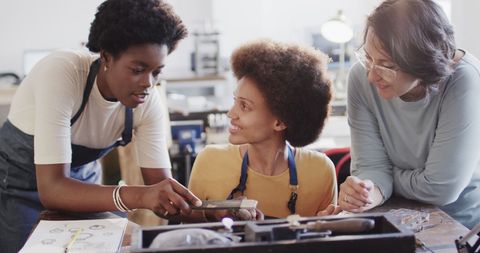 Creative women collaborating in craft workshop