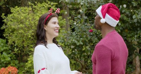 Festive Couple Enjoying Holiday Together Outdoors