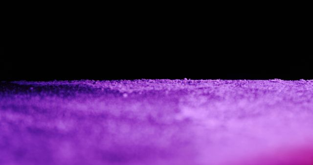 A close-up of a purple textured surface under a dark background. The image showcases a detailed texture that could be used for a creative background or design element.