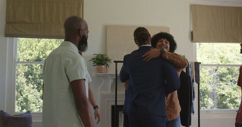 Friends preparing wardrobe for wedding celebration at home