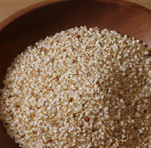 Close up of wooden bowl with multiple grains of rice quinoa on white background. Nature, plant and food concept.