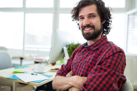 Confident Young Professional Relaxing in Modern Office
