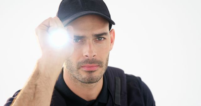 Security Guard Shining Flashlight in Camera - Download Free Stock Images Pikwizard.com