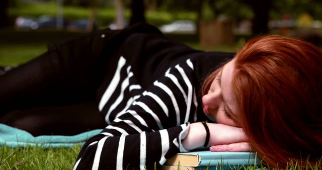 Young Woman Resting on Grass in Park on Sunny Day - Download Free Stock Images Pikwizard.com