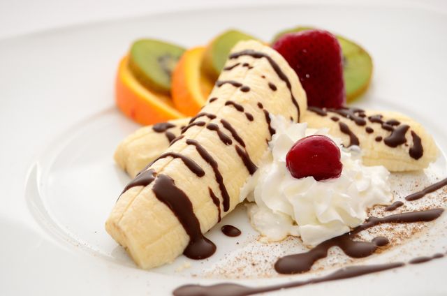 Gourmet Banana Split with Chocolate Syrup and Whipped Cream - Download Free Stock Photos Pikwizard.com