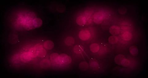Magenta fuchsia bokeh glow with sparkling orbs and nebula clouds on dark abstract backdrop