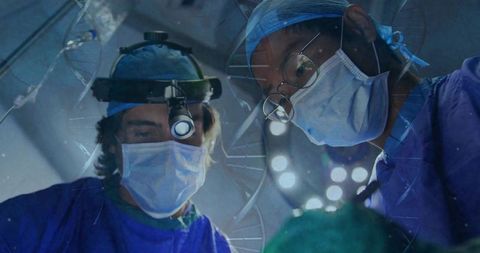 Surgeons Performing Precision Surgery in Operating Room