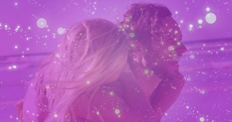 Joyful Couple on Beach Sparkling with Romance