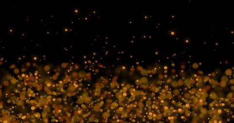 Glowing Gold Bokeh Lights on Black Background