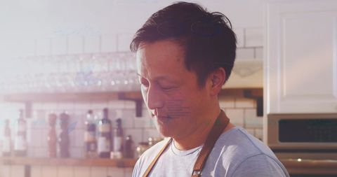 Asian Chef Engaging with Digital Restaurant Technology