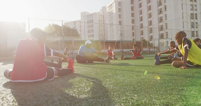 Youth Soccer Team Stretching During Practice on Sunny Field - Download Free Stock Images Pikwizard.com