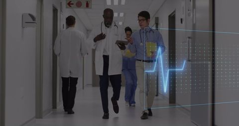 Doctors Collaborating in Modern Hospital with Heartbeat Overlay