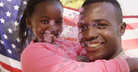 Father and daughter celebrating family love with american flag