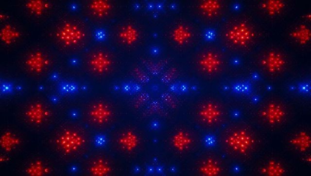 Pulsing geometric led kaleidoscope featuring red star clusters and blue neon dots luminous